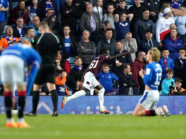 Heart of Midlothian's Garang Kuol (centre) celebrates scoring their side's second goal of the game during the cinch Premiership match at Ibrox Stadium