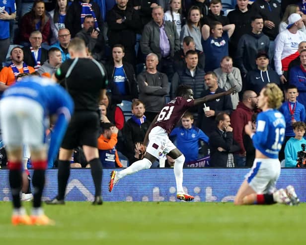 Heart of Midlothian's Garang Kuol (centre) celebrates scoring their side's second goal of the game during the cinch Premiership match at Ibrox Stadium
