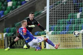 Kirk Millar slides in to score Linfield's winner deep into injury time against Dungannon Swifts.  Photo by David Maginnis/Pacemaker Press