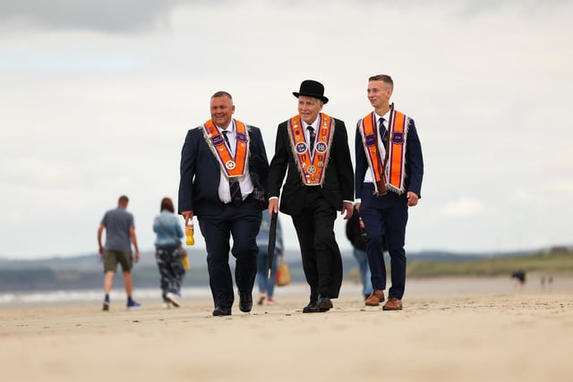 David Thompson, Jim Scott and Robbie Thompson take part in the annual Rossnowlagh procession, in Donegal