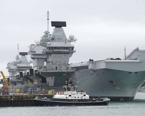 The Royal Navy aircraft carriers HMS Queen Elizabeth (right) and HMS Prince of Wales (left) alongside each other at Portsmouth in 2024. HMS Queen Elizabeth is to dock in Belfast Habour on Wednesday 7 October.