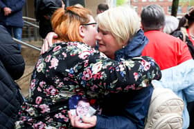 Covid Inquiry begins hearing evidence in Belfast and is set to run for three weeks at the  Clayton Hotel in Belfast City Centre.  More than 4,000 people in Northern Ireland died with Covid-19 during the first two years of the pandemic.Members of Bereaved Families for Justice NI arrive for the hearing.  Briege McEvoy receives a hug as she holds a picture of her son Conor who was 23 when he died on the 25th August 2021. Photo by Jonathan Porter/Press Eye