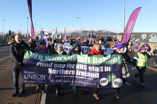 Public sector workers from Unison joined by other public sector workers walk from the picket line at the Royal Victoria Hospital to a rally at Belfast City Hall