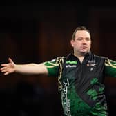 Brendan Dolan on his way to victory over Gary Anderson on day thirteen of the Paddy Power World Darts Championship at Alexandra Palace, London. PIC: Zac Goodwin/PA Wire.