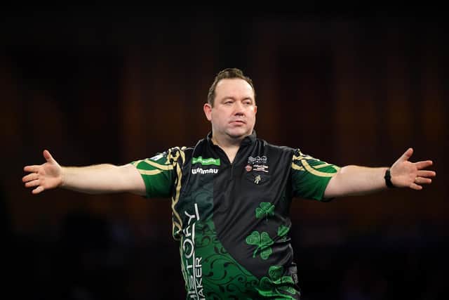 Brendan Dolan on his way to victory over Gary Anderson on day thirteen of the Paddy Power World Darts Championship at Alexandra Palace, London. PIC: Zac Goodwin/PA Wire.
