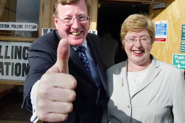 Daphne and David Trimble give the thumbs up  after casting their vote at an election