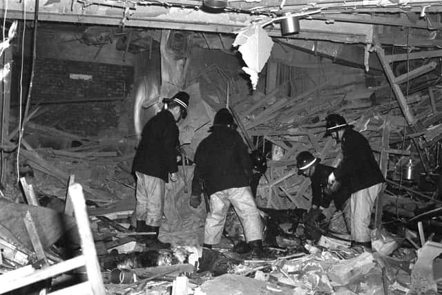 Firemen at work following the bomb attacks in Birmingham city centre that targeted the Mulberry Bush pub and the Tavern in the Town.