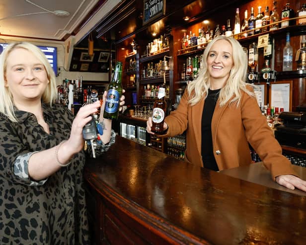 United Wines launched a designated driver campaign in the run-up to Christmas 2023 to support safe and responsible driving over the festive season. The company rewarded designated drivers with a free Heineken®0.0 or Birra Moretti Zero when they made themselves known to bar staff by showing their car keys at participating venues.  Pictured are Gemma Herdman and Maura Bradshaw of United Wines, enjoying a bottle of no alcohol beer at The Morning Star bar in Belfast’s city centre.  Picture: Phil Magowan / Press Eye