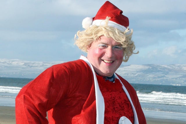 Harry McKendry having fun as Mrs. Claus during the Santa Run in aid of the Cystic Fibrosis Trust at Portstewart Strand on Saturday. CR51-275PL