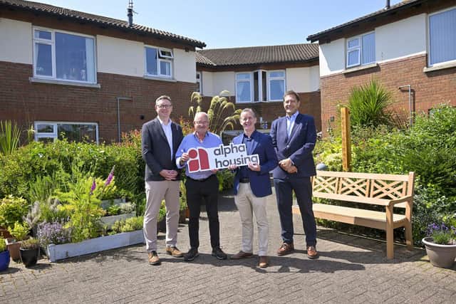 Alpha Housing is set to build more than 120 much-needed social homes with the help of a £10m loan facility that will help address the housing shortage in Northern Ireland. Pictured is Cameron Watt, chief executive of Alpha Housing; Victor Allister, Alpha Housing tenant; Gerard McKeown, COO; and Peter Borgers, senior relationship manager at Triodo (image credit: Alpha Housing)