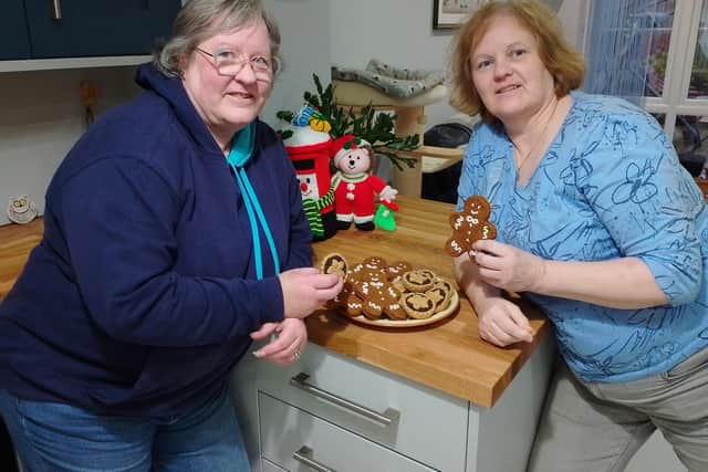 Holywood woman Lynda Wallace with her sister Suzanne Kelly and their knitted treats for Marie Curie