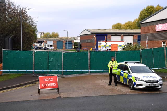 Police at the industrial estate in Grays on Eastern Avenue, Essex, where 39 bodies were discovered in a lorry.