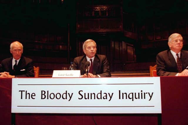 The three members of the 'Bloody Sunday Inquiry' (left to right), Sir Edward Somers, Lord Saville of Newdigate (chairman) and Mr Juistice William L. Hoyt