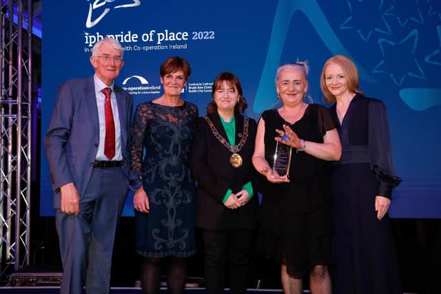 Dublin Lord Mayor Caroline Conroy presents the Pride of Place award to Terry McKeown from Sailortown. They won the Urban Neighbourhoods with a population under 3,000 category.