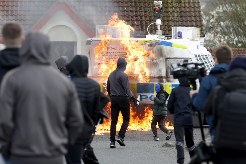 Youths throw petrol bombs at a PSNI vehicle ahead of a dissident Republican parade in the Creggan area of Londonderry on Easter Monday. Authorities have increased security measures in response to the unnotified parades being held in Derry. Picture date: Monday April 10, 2023.