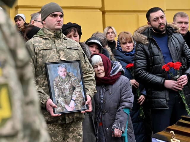 Relatives at the funeral in Kyiv of a Ukrainian serviceman killed fighting against Russian troops. As the Russian onslaught continues, Philip McGarry believes it is surprising and disappointing that there has not been a more radical debate about how we can try to reshape our world to mitigate against such war ever occurring again