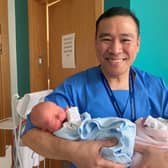 Midwife Vince Rosales with twins Aoife and Shea McGorrian