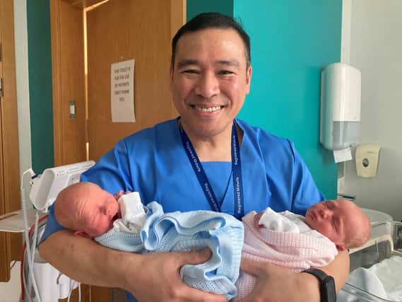 Midwife Vince Rosales with twins Aoife and Shea McGorrian