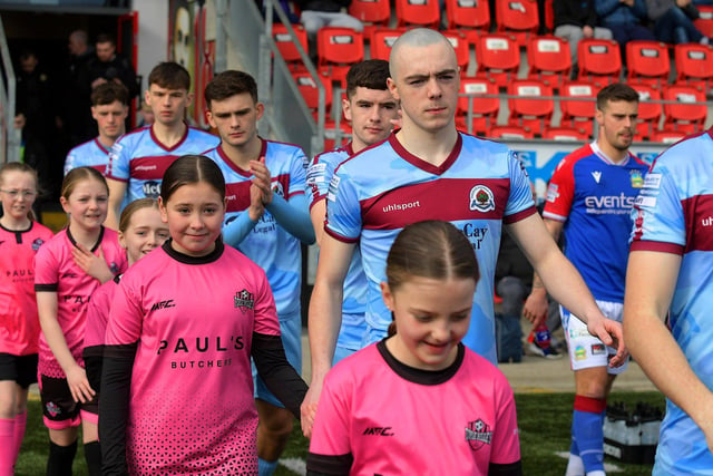 Institute players and mascots at the Brandywell on Sunday afternoon. Photo: George Sweeney