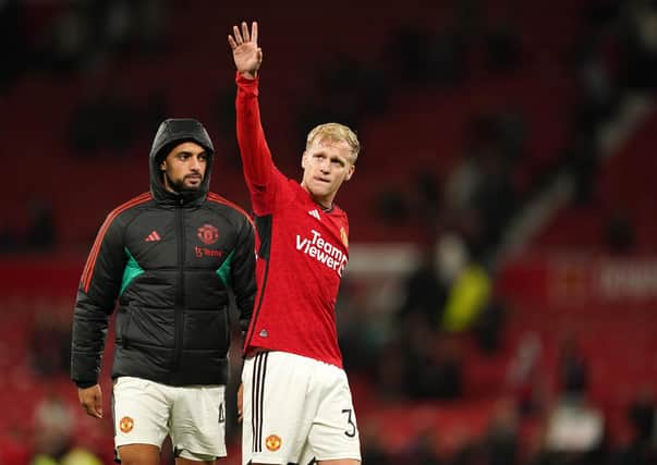 Donny van de Beek gestures to the Manchester United fans. (Photo by Martin Rickett/PA Wire)