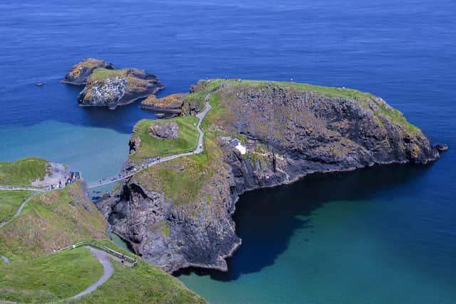 An outstanding aerial view of the Carrick-a-Rede Rope Bridge situated some 100ft above the Atlantic Ocean