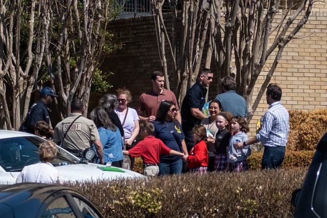 Children arrive at Woodmont Baptist Church to be reunited with their families after a mass shooting at The Covenant School in Nashville, Tennessee.