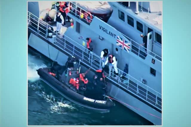 Border Force officers and Royal Navy sailors rescuing migrants from the English Channel