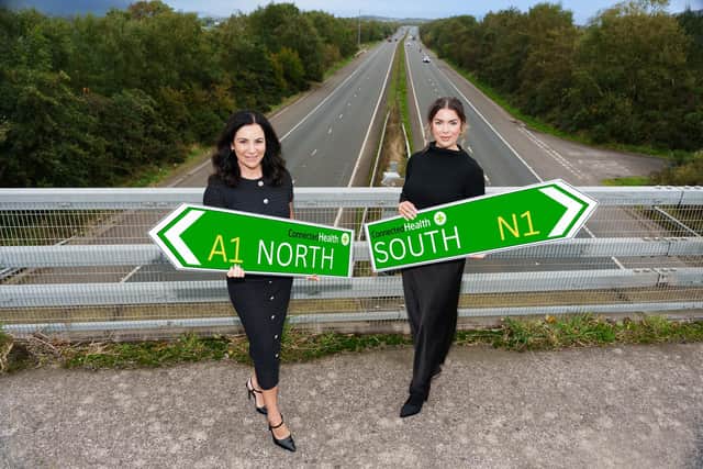 Rebecca Vogel Faulkner, managing director, Republic of Ireland and Lorraine Corr, managing director, Northern Ireland are signposting sustained growth for Connected Health across the island. They are pictured near the border on the M1 motorway. Photo credit: David Cordner - davidcordner.com