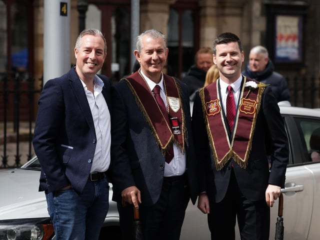 Paul Givan, Edwin Poots and Jonathan Buckley pictured before the main Apprentice Boys of Derry parade leaves Wallace Park in Lisburn.