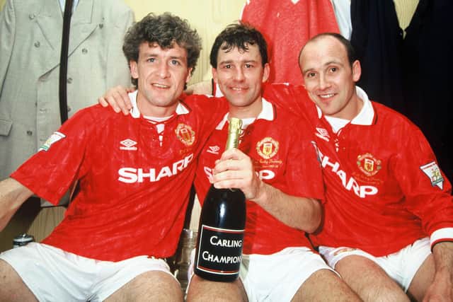 Manchester United's Mike Phelan (right) with, from left, Mark Hughes and Bryan Robson during the 1993/94 season. (Photo by John Peters/Manchester United via Getty Images)