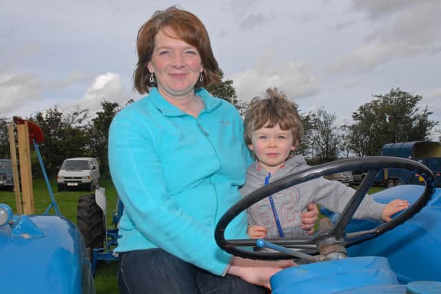 Ryan McDowell having fun on a tractor with his mum Barbara at Mounthill Fair in 2010. Picture: Larne Times archives
