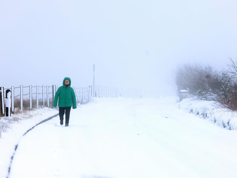 Snow fall on Divis and Black Mountain, West Belfast.Members of the public pictured on Divis Mountain on the outskirts of west Belfast.Picture by Jonathan Porter/PressEye