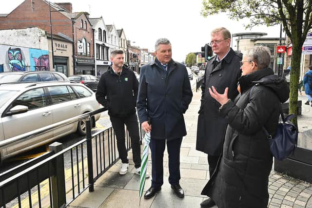 Lord Caine pictured with Mal McGrady and Baroness Margaret Ritchie on a walk around Downpatrick to see flood recovery efforts