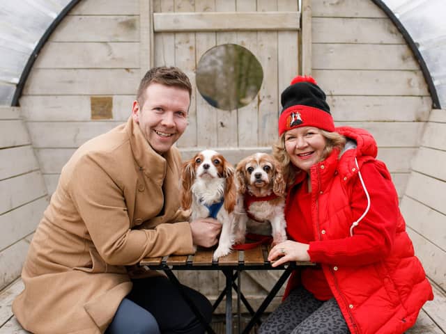 Owner of eightyfive90, Andrew Kelly and Rose with Glynis Hobson from Cavaliers in Need and Suzy. Both dogs were rescued from puppy farms by the charity and subsequently adopted by Andrew and Glynis