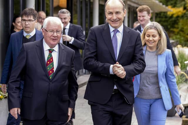 Taoiseach Micheal Martin (centre) with Brendan Smith TD (left) and Lorraine Clifford-Lee (right)  at the 62nd plenary of the British-Irish Parliamentary Assembly, Farnham Estate Spa and Golf Course in County Cavan, Ireland. PA Photo: Liam McBurney/PA Wire