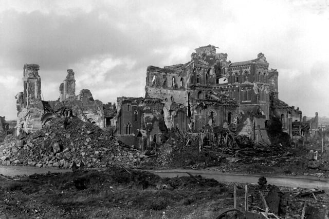 1918: The ruined basilica of Albert in northern France, former frontline town for British troops in the Somme region. The basilica was famous for its leaning statue of the Virgin and child which was finally toppled by British shellfire during the German offensive of March 1918, 'The Kaiser's Battle', in order to prevent its use as an observation post.  Picture part of PA First World War collection.:-