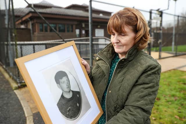 Bernadette McKearney, widow of Kevin McKearney, holding an image of her husband outside Craigavon Court, Co Armagh, during the inquest into the 1992 deaths of Kevin McKearney, Jack McKearney, Charles Fox and Teresa Fox.