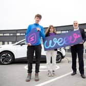 South West College is plugging into a greener future with new electric vehicle (EV) chargers provided by leading charge point operator Weev. Pictured are South West College students Fiacra Avery and Zara Hutchinson with Weev CEO Philip Rainey