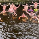 The Dunmurry Dippers take part in their 365th swim in a year at the Colin River in Dunmurry.