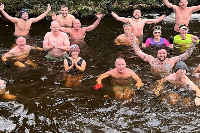 The Dunmurry Dippers take part in their 365th swim in a year at the Colin River in Dunmurry.