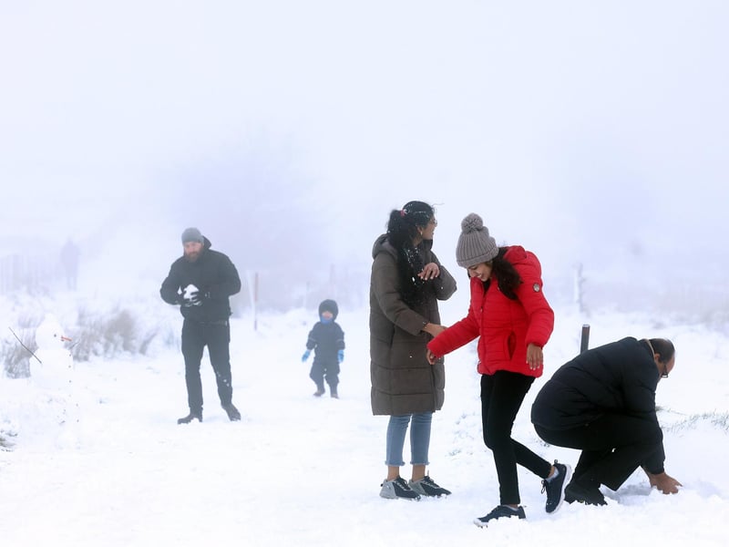 Snow fall on Divis and Black Mountain, West Belfast.Members of the public pictured on Divis Mountain on the outskirts of west Belfast.Picture by Jonathan Porter/PressEye