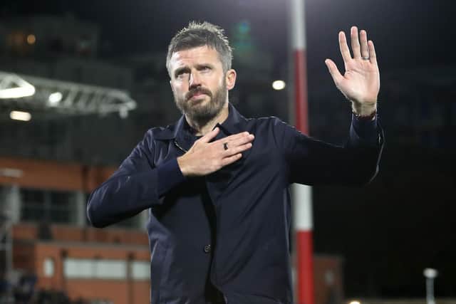 Manchester United manager Michael Carrick gestures to the fans after Wednesday's Champions League loss by 4-1 to Como. (Photo by Marco Luzzani/Getty Images)