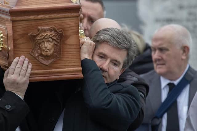 Daniel O'Donnell carries the remains of his beloved sister Kathleen into St Mary's Church, Kincasslagh while her husband John walks beside them. Photo: NW Newspix