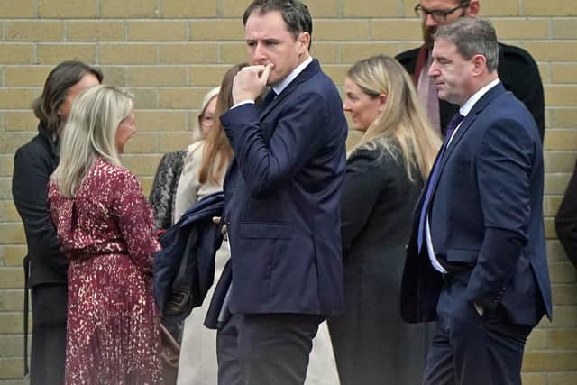 Minister for Agriculture, Food and the Marine, Charlie McConalogue (centre) arrives for the funeral mass of James O'Flaherty at St Mary's Church, Derrybeg.