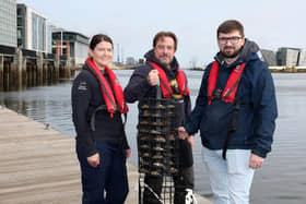 Belfast Harbour, in partnership with Ulster Wildlife, has installed an oyster nursey in the port to help restore the native population of the species, improve water quality and boost marine biodiversity. According to Ulster Wildlife, one oyster can filter up to 200 litres of water per day, which is the equivalent to a bathtub. Pictured are Rachel Millar, marine conservation officer, Ulster Wildlife, Dr Dave Smyth, marine conservation manager, Ulster Wildlife and Simon Gibson, marine, environment & biodiversity officer, Belfast Harbour
