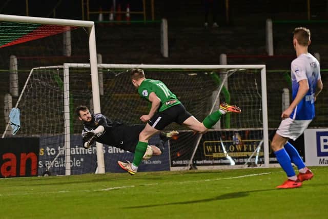 Glenavon goalkeeper Rory Brown pulls off a save to deny Glentoran's Terry Devlin in last night's scoreless draw