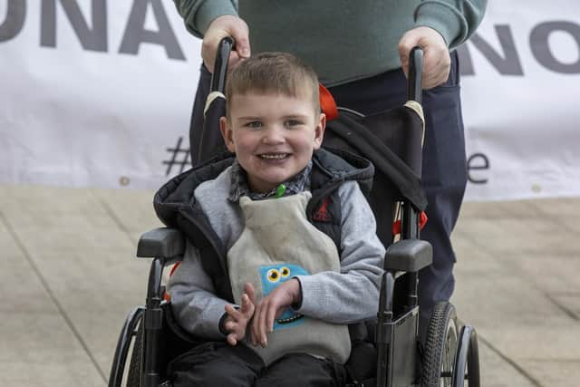 Six-year-old Daithi Mac Gabhann outside Parliament Buildings at Stormont, ahead of a recalled sitting of the Assembly focused on a stalled organ donation law. The law introducing an opt-out donation system in Northern Ireland has been named after Daithi, who is awaiting a heart transplant.. Picture date: Tuesday February 14, 2023.