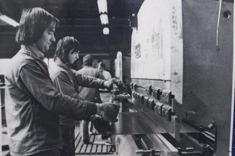 Men pictured folding the locker bodies before de-greasing and welding in Sperrin Metal's factory during the 1970s