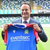 Taoiseach Leo Varadkar receives a shirt during a visit to Linfield at Windsor Park in Belfast. The Taoiseach got a tour of the club by Linfield representative, and meeting with players from the academy. Pic Colm Lenaghan/Pacemaker