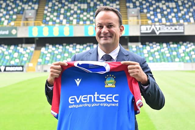 Taoiseach Leo Varadkar receives a shirt during a visit to Linfield at Windsor Park in Belfast. The Taoiseach got a tour of the club by Linfield representative, and meeting with players from the academy. Pic Colm Lenaghan/Pacemaker